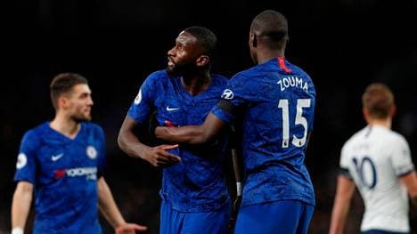 Chelsea's French defender Kurt Zouma (R) and Chelsea's German defender Antonio Rudiger (2nd L) reacts during the English Premier League football match between Tottenham Hotspur and Chelsea at Tottenham Hotspur Stadium in London, on December 22, 2019. (Photo by Adrian DENNIS / AFP) / RESTRICTED TO EDITORIAL USE. No use with unauthorized audio, video, data, fixture lists, club/league logos or 'live' services. Online in-match use limited to 120 images. An additional 40 images may be used in extra time. No video emulation. Social media in-match use limited to 120 images. An additional 40 images may be used in extra time. No use in betting publications, games or single club/league/player publications. /  (Photo by ADRIAN DENNIS/AFP via Getty Images)
