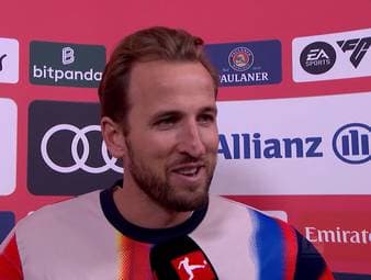 Topstürmer Harry Kane hat die 20-Tore-Marke mit seinem Traumtor beim 8:1-Sieg gegen den VfL Wolfsburg erreicht und spricht darüber, wie er sich beim Rekordmeister fühlt.