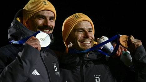 Axel Jungk und Christopher Grotheer jubeln in Cortina