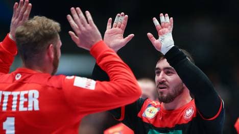 VIENNA, AUSTRIA - JANUARY 20: Johannes Bitter of Germany celebrates with Jannik Kohlbacher during the Men's EHF EURO 2020 main round group I match between Austria and Germany at Wiener Stadthalle on January 20, 2020 in Vienna, Austria. (Photo by Martin Rose/Bongarts/Getty Images)