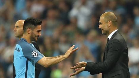 Ilkay Gündogan und Pep Guardiola von Manchester City