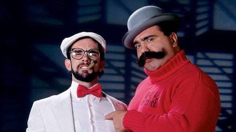 Big Bully Busick (r., mit Manager Harvey Wippleman) war zwischen 1989 und 1991 bei der WWF aktiv