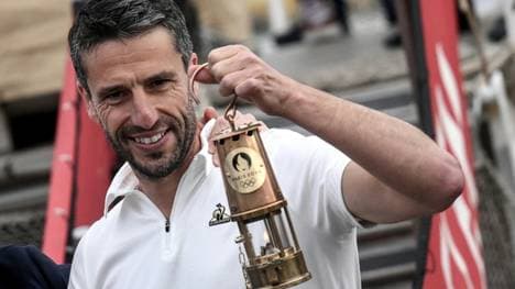 Estanguet mit dem Olympischen Feuer