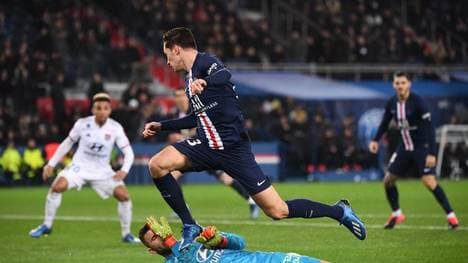 Paris Saint-Germain's German midfielder Julian Draxler jumps over Lyon's Portuguese goalkeeper Anthony Lopes during the French L1 football match between Paris Saint-Germain (PSG) and Lyon (OL) at the Parc des Princes stadium in Paris, on February 9, 2020. (Photo by FRANCK FIFE / AFP) (Photo by FRANCK FIFE/AFP via Getty Images)