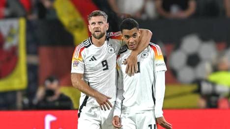 Niclas Füllkrug (l.) muss vorzeitig abreisen