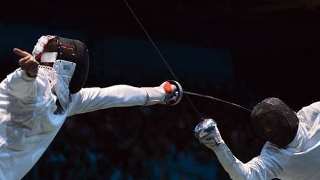 Germany's Jörg Fiedler (L) fences agains