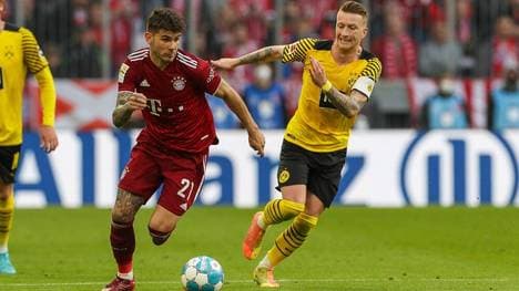 Lucas Hernandez im Zweikampf mit Marco Reus