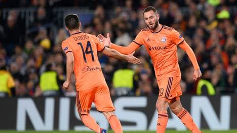Lyon's French midfielder Lucas Tousart (R) celebrate with Lyon's French defender Leo Dubois after scoring during the UEFA Champions League round of 16, second leg football match between FC Barcelona and Olympique Lyonnais at the Camp Nou stadium in Barcelona on March 13, 2019. (Photo by Josep LAGO / AFP)        (Photo credit should read JOSEP LAGO/AFP via Getty Images)