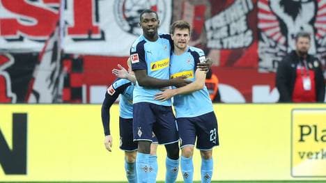 LEVERKUSEN, GERMANY - NOVEMBER 02:  Marcus Thuram of Borussia Monchengladbach (L) celebrates as he scores his team's second goal with Jonas Hofmann during the Bundesliga match between Bayer 04 Leverkusen and Borussia Moenchengladbach at BayArena on November 02, 2019 in Leverkusen, Germany. (Photo by Christof Koepsel/Bongarts/Getty Images)