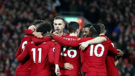 LIVERPOOL, ENGLAND - JANUARY 02: Mohamed Salah of Liverpool celebrates with his team mates after scoring his team's first goal during the Premier League match between Liverpool FC and Sheffield United at Anfield on January 02, 2020 in Liverpool, United Kingdom. (Photo by Clive Brunskill/Getty Images)