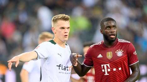 Dayot Upamecano (r.) und die Bayern treffen auf Gladbach um Matthias Ginter (l.)