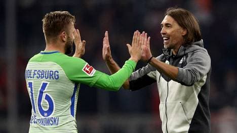Martin Schmidt und Jakub Blaszczykowski bejubeln das Unentschieden bei den Bayern