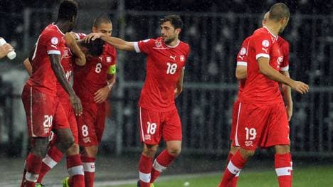 Switzerland's midfielder Granit Xhaka (2nd L) jubilates after scoring a goal during the 2014 FIFA World Cup qualifying football match between Switzerland and Slovenia on October 15, 2013, at the Stade de Suisse in Bern. AFP PHOTO / SEBASTIEN BOZON        (Photo credit should read SEBASTIEN BOZON/AFP via Getty Images)