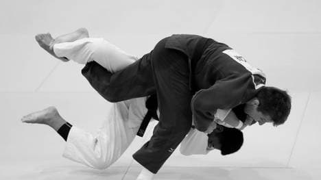 TOKYO, JAPAN - AUGUST 28: Jack Hatton (blue) of the United States and Marco Tumampad (white) of the Philippines compete in the Men's -81kg Pool C first round on day four of the World Judo Championships at the Nippon Budokan on August 28, 2019 in Tokyo, Japan. (Photo by Kiyoshi Ota/Getty Images)