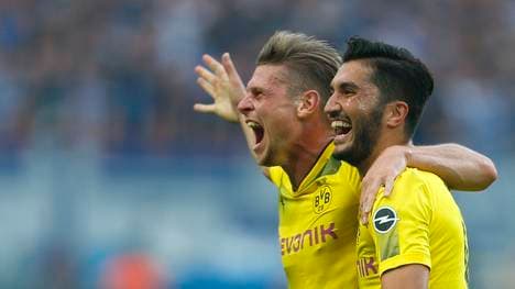 Lukasz Piszczek und Nuri Sahin feiern den Sieg gegen Berlin