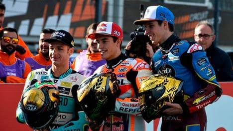 MotoGP world champion Repsol Honda Team's Spanish rider Marc Marquez (C) poses with Moto2 world champion EG 0,0 Marc VDS's Spanish rider Alex Marquez (L) and Moto3 world champion Leopard Racing's Italian rider Lorenzo Dalla Porta before the MotoGP race of the Valencia Grand Prix at the Ricardo Tormo racetrack in Cheste near Valencia, on November 17, 2019. -  (Photo by JOSE JORDAN / STR / AFP) (Photo by JOSE JORDAN/STR/AFP via Getty Images)