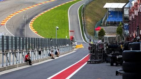 Mechanics sit in a deserted pit lane following a serious accident involving several drivers during a Formula 2 race at the Spa-Francorchamps circuit in Spa, Belgium, on August 31, 2019. - Motor racing prospect Anthoine Hubert was killed by a horrific high-speed crash just minutes into the Formula Two race held before this weekend's F1 Belgian Grand Prix, the FIA announced. Hubert, who was considered a serious talent by Renault's F1 set up, died aged 22 following a three-car pile-up also involving Juan Manuel Correa and Giuliano Alesi at the exit of the Raidillon corner, one of the fastest sections of the quick Spa-Francorchamps track. (Photo by Remko de Waal / ANP / AFP) / Netherlands OUT - Belgium OUT        (Photo credit should read REMKO DE WAAL/AFP/Getty Images)