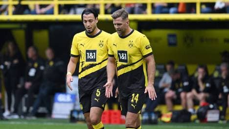 Ramy Bensebaini (l., mit Niclas Füllkrug) erntet Kritik von Christoph Daum