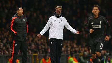 MANCHESTER, ENGLAND - MARCH 17:  Jurgen Klopp, manager of Liverpool reacts as Ryan Giggs Assistant Manager of Manchester United looks on during the UEFA Europa League round of 16, second leg match between Manchester United and Liverpool at Old Trafford on March 17, 2016 in Manchester, England.  (Photo by Clive Brunskill/Getty Images)