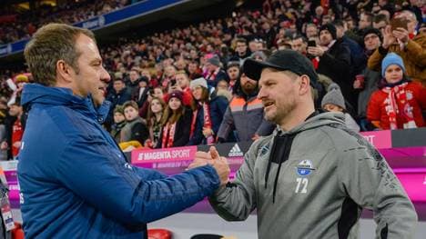 Bayern Munich's German head coach Hansi Flick (L) greats Paderborn's German head coach Steffen Baumgart as he arrives for the German first division Bundesliga football match FC Bayern Munich v SC Paderborn in Munich, southern Germany, on February 21, 2020. (Photo by Guenter SCHIFFMANN / AFP) / RESTRICTIONS: DFL REGULATIONS PROHIBIT ANY USE OF PHOTOGRAPHS AS IMAGE SEQUENCES AND/OR QUASI-VIDEO (Photo by GUENTER SCHIFFMANN/AFP via Getty Images)