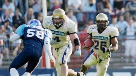 HAMBURG, GERMANY - JULY 24:    American Football: German Football League 2004, Hamburg; Hamburg Blue Devils - Dresden Monarchs; Martin ZIMMERMANN / Blue Devils, Bernd SCHWARTEN und Bruce MOLOCK / Dresden Monarchs 24.07.04.  (Photo by Malte Christians/Bongarts/Getty Images)