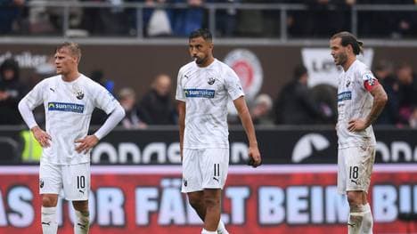 HAMBURG, GERMANY - SEPTEMBER 29: (L-R) Julius Biada, Aziz Bouhaddouz and Dennis Diekmeier of SV Sandhausen looks dejected after the Second Bundesliga match between FC St. Pauli and SV Sandhausen at Millerntor Stadium on September 29, 2019 in Hamburg, Germany. (Photo by Oliver Hardt/Bongarts/Getty Images)
