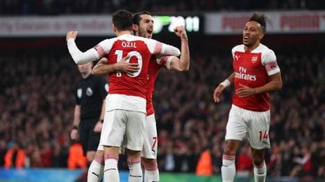 LONDON, ENGLAND - FEBRUARY 27: Henrikh Mkhitaryan of Arsenal celebrates after scoring his team's second goal with Mesut Ozil of Arsenal during the Premier League match between Arsenal FC and AFC Bournemouth at Emirates Stadium on February 27, 2019 in London, United Kingdom. (Photo by Catherine Ivill/Getty Images)