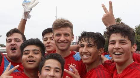 FC Bayern Muenchen Opens Training Session For Refugees