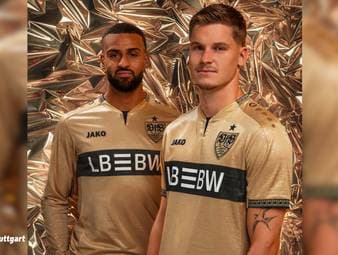 Der VfB Stuttgart hat sein neues Ausweichtrikot für die Saison 2026/27 vorgestellt. Inspiriert vom berühmten Cannstatter Goldfund setzt das gold-schwarze Design ein Zeichen für die Geschichte Bad Cannstatts.