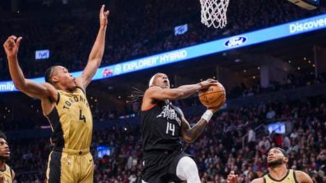 January 26, 2024, Toronto, On, CANADA: Los Angeles Clippers guard Terance Mann (14) goes up to the net while guarded by Toronto Raptors forward Scottie Barnes (4) and forward Bruce Brown (11) during first half NBA, Basketball Herren, USA basketball action, in Toronto on Friday, January 26, 2024. Canada News - January 26, 2024 PUBLICATIONxINxGERxSUIxAUTxONLY - ZUMAc35_ 20240126_zaf_c35_127 Copyright: xChristopherxKatsarovx