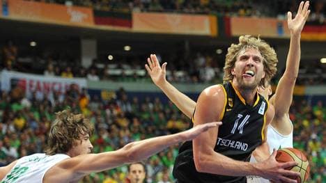 Lithuania's Simas Jasaitis  (L) vies wit